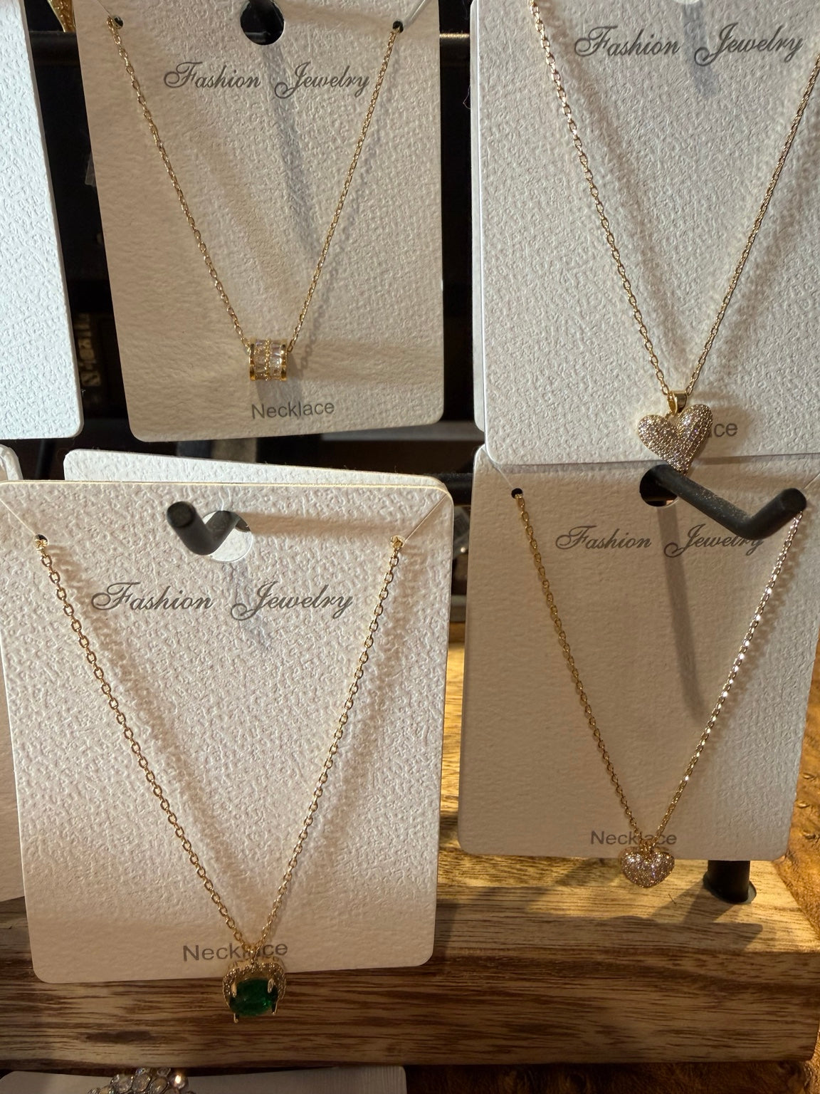 Gold necklaces with crystal and heart pendants