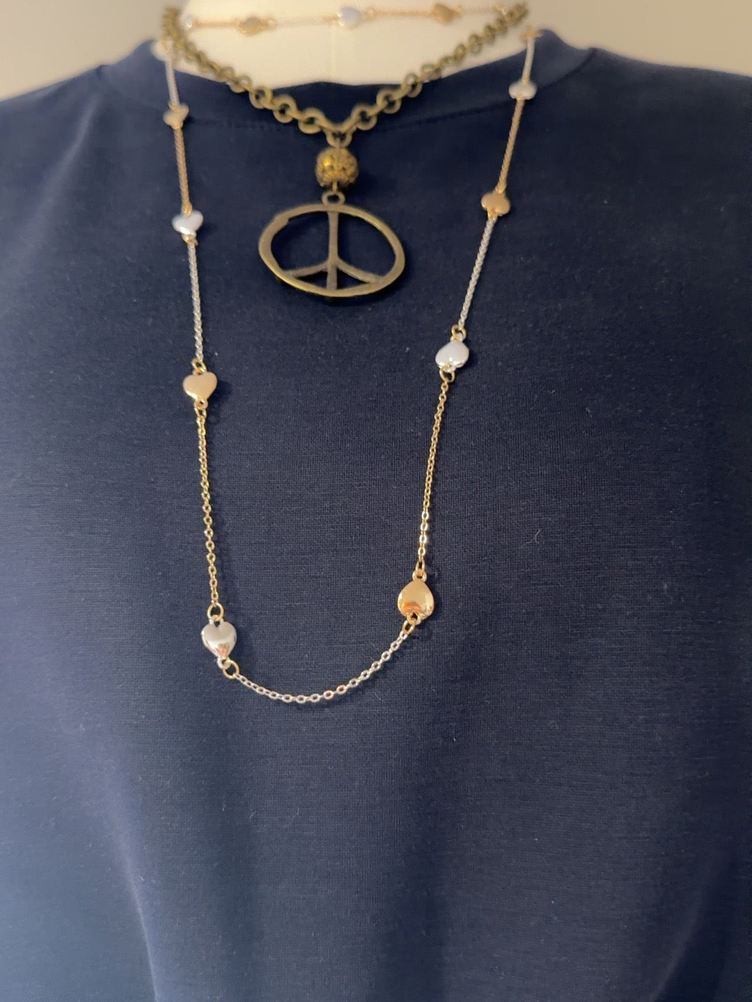 Mixed-metal necklace with alternating silver- and gold-tone heart charms