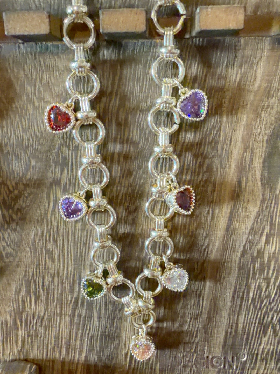 Silver link necklace with colorful gemstone heart charms